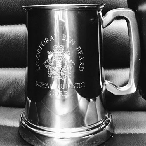 Machine engraved pewter tankard with military insignia