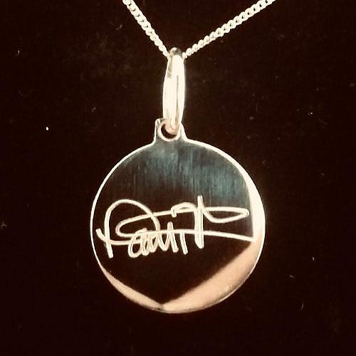 Machine engraved signature on necklace