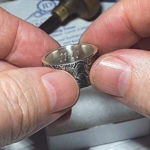 Hand engraving on the inside of a Gin Coin Jewellery silver ring