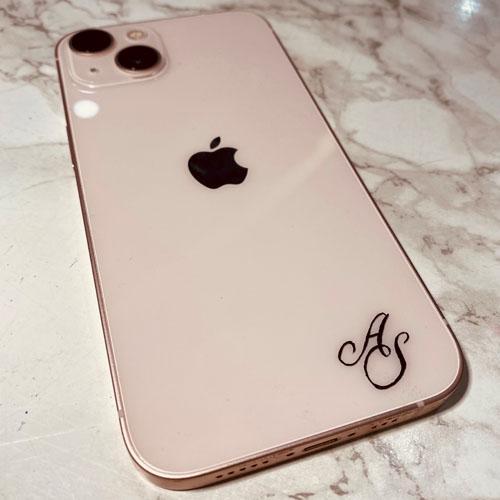 Apple iPhone hand engraved with the initials A S in a script font