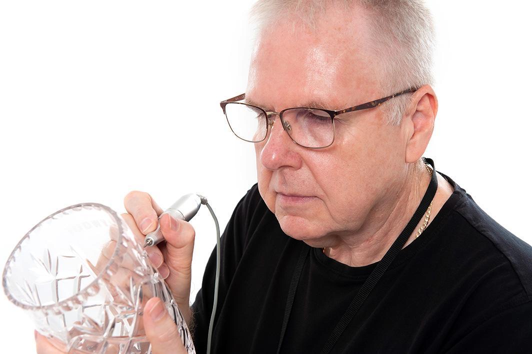 John Dearden hand engraving a crystal vase