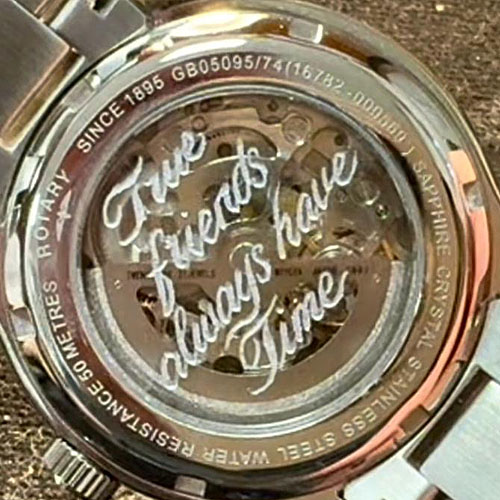 Hand inscribed glass back of a Rotary skeleton watch Hand inscribed glass back of a Rotary skeleton watch